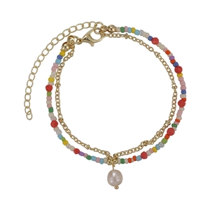 Double-layered beaded bracelet with colorful seed beads, golden chain and a pearl charm