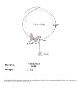 Détails du pendentif papillon coloré avec perle et dimensions précises en centimètres