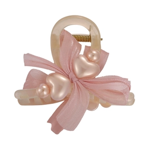 Pink chiffon bow hair claw clip with heart pearls and resin teeth on white background