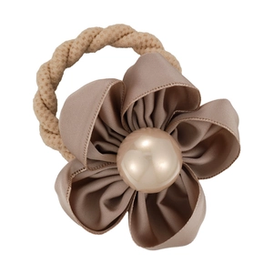 Elegant camellia hair scrunchie with champagne satin flower and glossy pearl accent