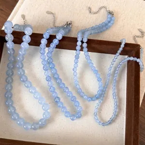 Three sea blue beaded necklaces with silver adjustable chains in different bead sizes