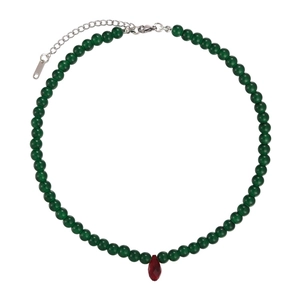Vintage green beaded necklace featuring a faceted red teardrop pendant and silver clasp