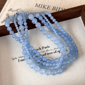 Elegant multi-layer aquamarine bead necklace with five strands of round blue stone beads