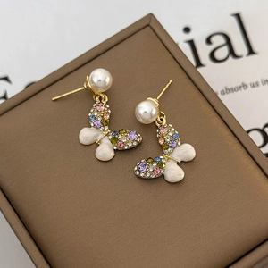 Elegant gold butterfly earrings with colorful rhinestones, pearls and enamel finish