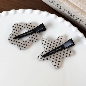 Set di fermagli per capelli a pois bianchi e neri in acrilico con fiore e stella