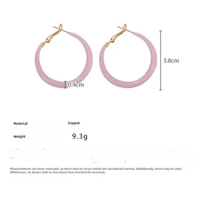 Detailed view of 3.8cm pink enamel hoop earrings with copper base and size specifications