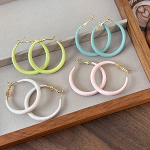 Colorful macaron hoop earrings set in pastel green, blue, pink, and cream white