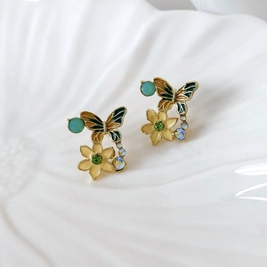 Retro butterfly and flower enamel drop glaze earrings in gold with green gemstone accents