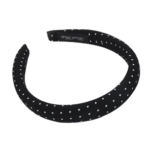 Vintage black polka dot satin headband with handmade label on white background