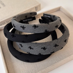 Minimalist flocking bow headbands in black and gray with handmade embroidery detail