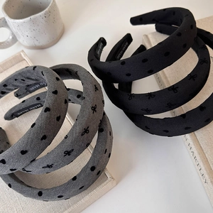Minimalist wide sponge headbands in grey and black with bow details and velvet dots