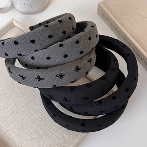 Detail of padded headbands featuring heart, polka dot and embroidered bow patterns