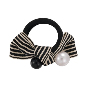 Elegant black and white striped bow hair tie with faux pearl and beads on white background