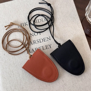 Portable faux leather hat and scarf clip accessories in brown and black finishes