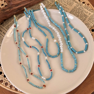 Layered turquoise beads and pearl necklace set with bohemian gold accents for women