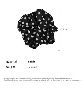 Detailed size specifications of a 25cm large polka dot fabric scrunchie in black and white