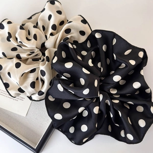 Elegant polka dot satin scrunchie set in black and white with high-gloss finish