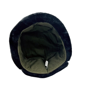 Detail of the thick plush lining and quilted inner fabric of the winter trapper hat