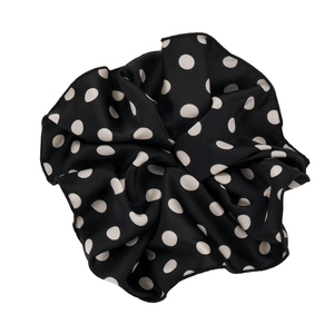 Classic vintage polka dot scrunchie in black satin fabric with elegant white patterns