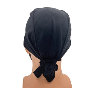 Detail of black breathable mesh skull cap with adjustable tie-back design for cycling