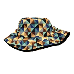 Reversible bucket hat with colorful geometric triangle patterns in blue and brown