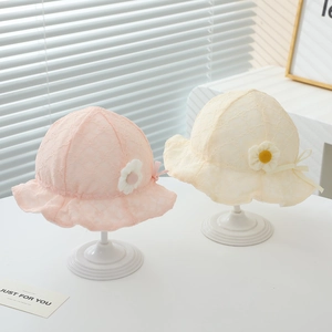 Detailed embroidery and daisy floral decor on pink and cream baby lace sun hats