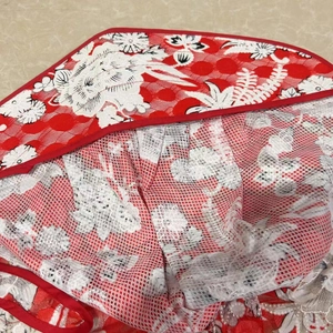 Women summer sun hat with wide brim in red and white lace fabric featuring floral patterns