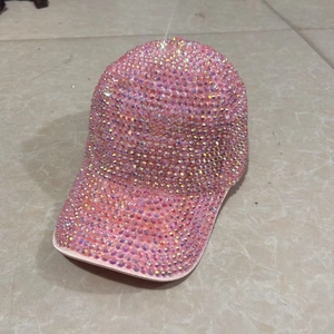 Detailed view of shiny pink rhinestones on a stylish street dance baseball cap