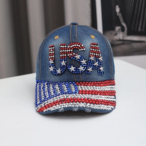 Detail of USA lettering and metal star sequins on navy blue denim baseball cap