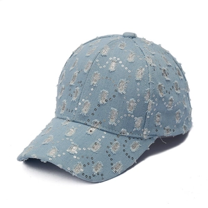 Distressed denim baseball cap with silver sequins and ripped vintage details