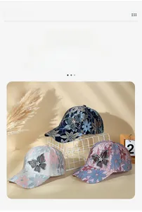 Close-up of breathable lace mesh baseball caps with rhinestone butterfly detailing