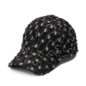Stylish black denim baseball cap featuring sparkly sequins and distressed ripped details