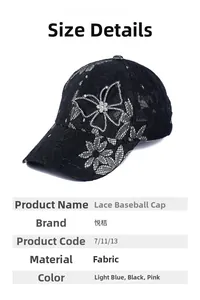 Detailed close-up of a black lace baseball cap featuring a sparkling rhinestone butterfly
