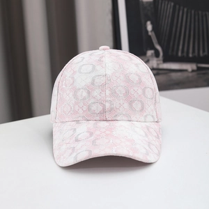 Close-up of pink lace baseball cap featuring intricate geometric patterns and mesh