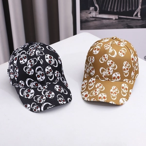 Fashionable baseball caps in black and khaki with all-over skull prints for sun protection