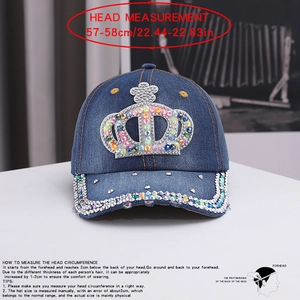 Detailed view of denim baseball cap with rhinestone crown patch and colorful studs