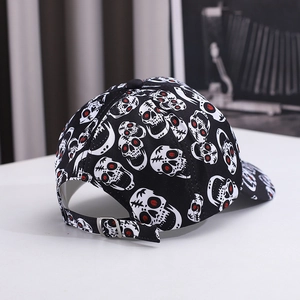 Black cotton baseball cap with skull prints and silver metal adjustment buckle back view