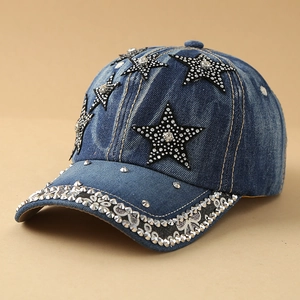 Detail of blue denim baseball cap with rhinestone stars and silver metal rivets