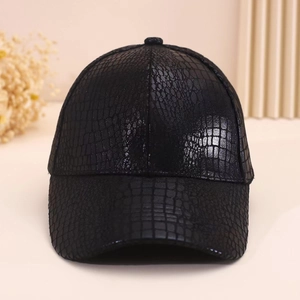 Close-up showing the glossy faux crocodile leather texture on this black baseball cap