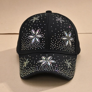 Front detail of black baseball cap decorated with colorful rhinestone flower patterns