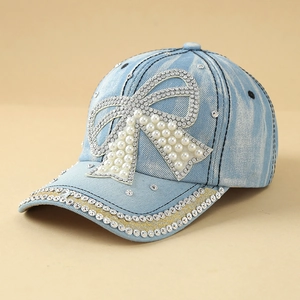 Denim baseball cap for women with large pearl bow and rhinestone brim accents