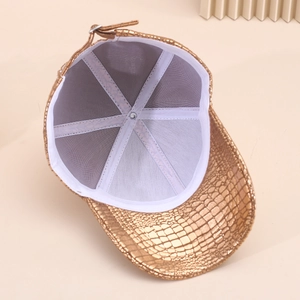 Top view of gold metallic baseball cap showing faux crocodile texture and inner stitching