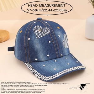 Detailed view of denim baseball cap with rhinestone hearts and silver studs embellishments