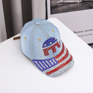 Detail of elephant logo and star pattern with sparkling rhinestones on denim baseball cap