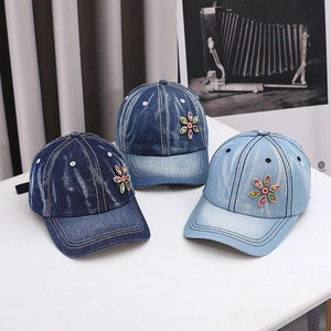Denim baseball caps with colorful rhinestone flower accents in three vintage washes