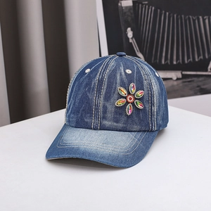 Denim baseball cap with colorful rhinestone flower decoration and washed finish