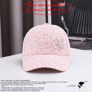 Detail showing pink lace baseball cap with rhinestone flower and 57-58cm head measurement