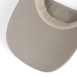 Close-up of breathable mesh fabric and durable stitching on a grey sun visor hat brim