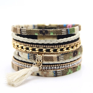 Detail view of Bohemian multi-layer bracelet with ethnic tassels and crystal rhinestones