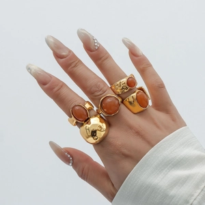 Retro gold alloy ring set with amber acrylic stones and textured hammered surfaces